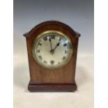 An Edwardian dome top mantel timepiece, 20cm high, and an American wall clock, 66 x 39 x 10.5cm