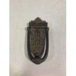 A Kenrich & Sons cast iron door knocker, 19cm highProvenance:Property of a collector, removed from