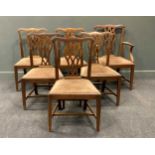 A set of six George III style mahogany dining chairs, to include one carver, with serpentine top