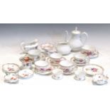 A collection of Dresden and other floral decorated porcelain, including teacups, sugar bowl, milk