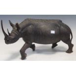 A carved wooden rhino, 24.5cm high