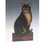 A painted wooden doorstop of a cat, 41.5cm highAltogether made up, minor chips to the edges with