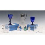 A plated mounted glass claret jug, two scent bottles, two Bristol blue drinking glasses and other