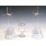 A pair of cut glass candle sticks with cut glass shades, together with a singular stemmed vase (3)