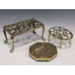 Three brass trivets, to include an octagonal brass trivet with Celtic knot decoration, a rectangular