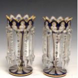A pair of blue flash lustres 25cm high, (2)Fading to gilt decoration. Some minor chipping to the top