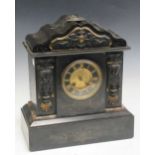 A Victorian slate mantel clock dial encased in the centre of two columns decorated with female