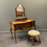 A Queen Anne style walnut dressing table 79 x 108 x 56cm and dressing table mirror 72 x 57 x 19cm,