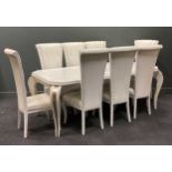 A Florence Collection white painted extending dining table with eight chairs, with white painted