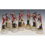 A set of eleven continental porcelain figures of musicians, in 18th century military attire (one A/