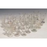 Various glass wine goblets and tumblers some with engravings of berries and birds