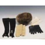 A Fur hat by Sylvia Fletcher at James Lock & Co., together with four pairs of ladies gloves to