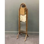 A Queen Anne style walnut framed cheval mirror 160 x 42 x 51cm, a two door walnut bedside cabinet on