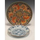 A Charlotte Rhead 1930s Crown Ducal tube line plate, 33cm diameter, and an 18th century blue and