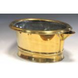 A brass foot bath with pouring spout, 24 x 53 x 36cm