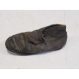 A child's concealed leather shoe, likely to be 18th century