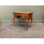 A Queen Anne revival walnut dressing table comprising of four drawers on cabriole legs, 74 x 84 x