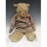 A large early 20th century teddy bear, 63cm high; together with another stuffed dogProvenance: