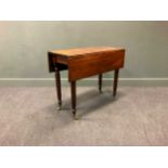 A Regency mahogany drop leaf table with reeded legs, 74 x 92 x 40cm (closed) 74 x 92 x 85cm (open)