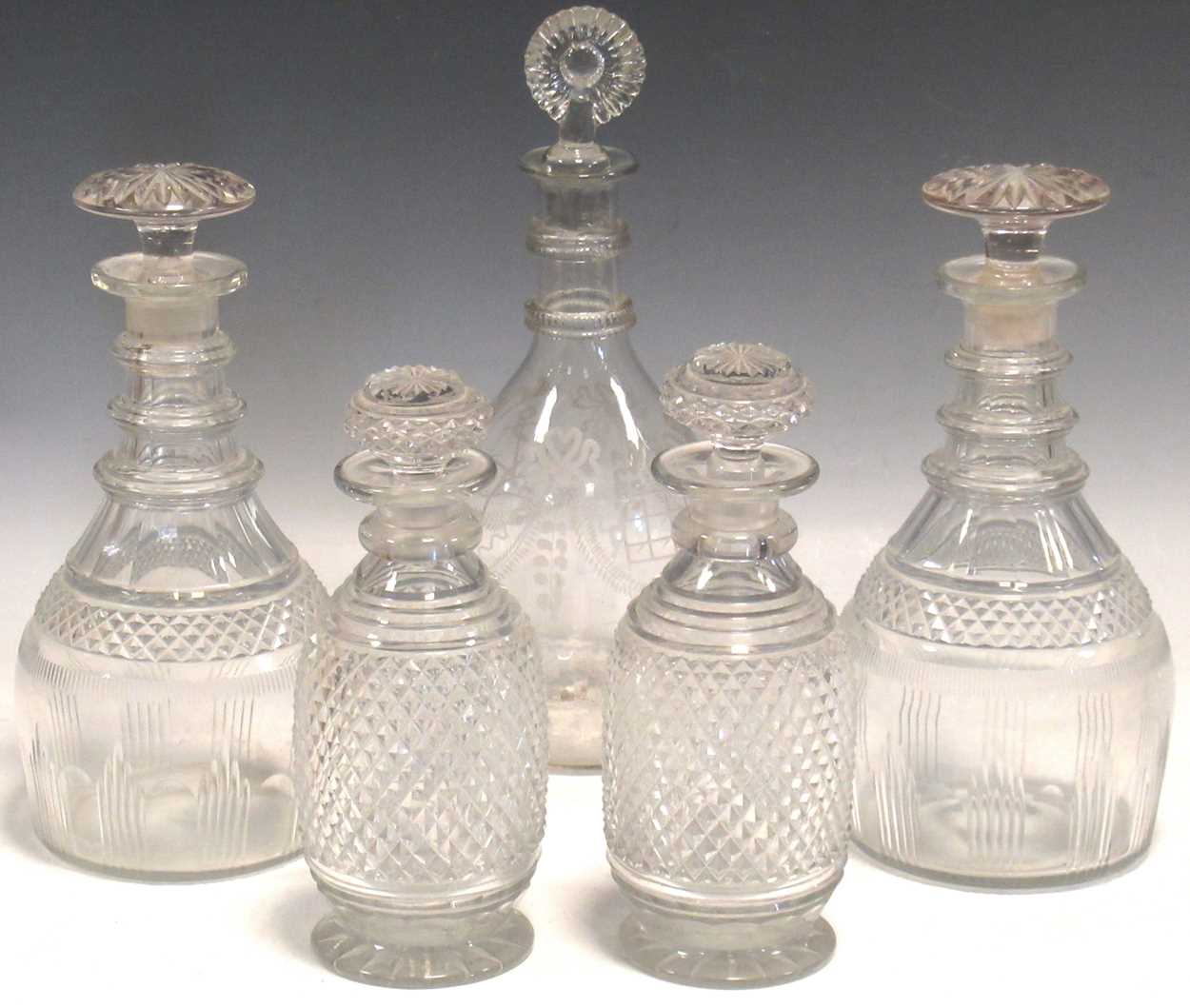 A near pair of 19th century hobnail cut decanters and stoppers; a pair of George III decanters and