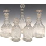 A near pair of 19th century hobnail cut decanters and stoppers; a pair of George III decanters and