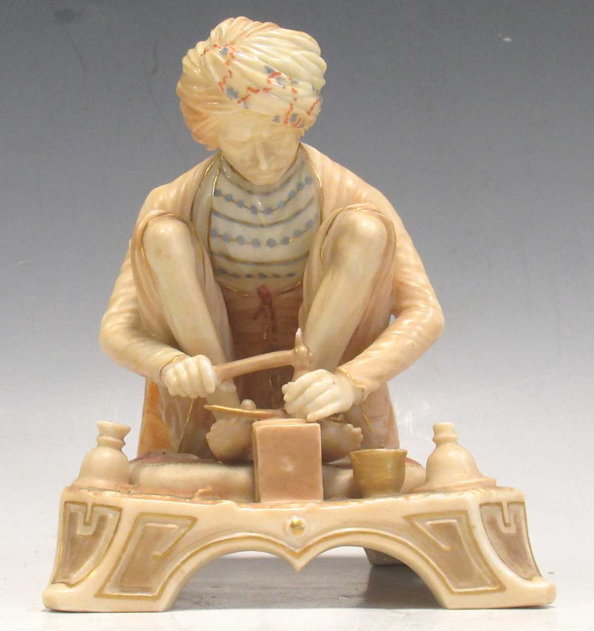 A Royal Worcester figure of Karan Singh the trinket maker from the Indian Craftsmen series, late