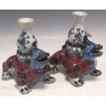 A pair of Chinese vases as mythical animals, 18cm highDamage and chipping to extremities. Rubbing