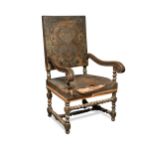 A French 17th century style oak and leather upholstered armchair, 19th century,