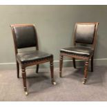 A pair of 19th century mahogany dining chairs with lotus leaf carved tapering front legs on