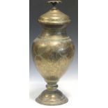 A Middle Eastern brass vase and cover with floral finial, 57cm high