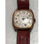 J. W. Benson - A 9ct gold wristwatch on a leather strap