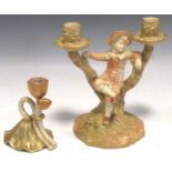 A late 19th century Royal Worcester blush ivory candelabrum modelled as a boy on a tree stump 20.5cm