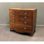 A Regency mahogany bow front chest of drawers, comprising of two short over three long drawers