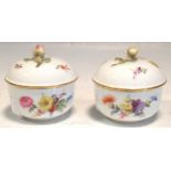 Two Meissen bowls with covers, painted with flowers, cross swords mark, 9cm high and 9cm diameter (
