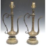 A pair of large Indian black metal gilt engraved Moorish ewers converted into lamps, 53cm high