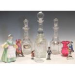 Four decanters with labels, two cranberry glasses, a wine glass, two model soldiers, a Royal Doulton