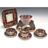 An 18th century part English porcelain tea service in Imari Beast pattern, including teacups and