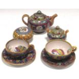 Alfredo Santarelli, a lustrous faience tea for two, including two teacups and saucers, a teapot, a