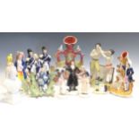 A group of Staffordshire figures to include 'The Death of Nelson', an inkwell modelled as a Turk,