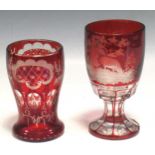 A 19th century Bohemian red cameo glass engraved with deer; together with another, tallest 15cm