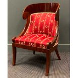 A Russian mahogany tub chair, with carved top rail on front sabre legsProvenance:Collection of Barry