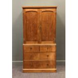 A 20th century oak linen press with chip carved decoration, the doors above two short over two