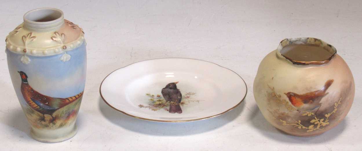 A small Worcester plate painted with a blackbird, a vase painted with a pheasant, 11cm high, and