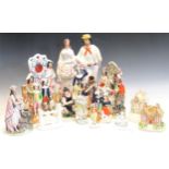 A large collection of various 19th century and later Staffordshire figures, pastille burners etc,