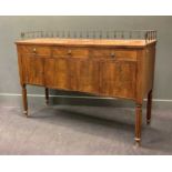 A Regency style mahogany sideboard with three-quarter brass spindle-work gallery above three drawers