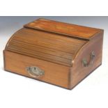 A late Georgian mahogany tambour top desk stand with inkwells and two small drawers with bone knob