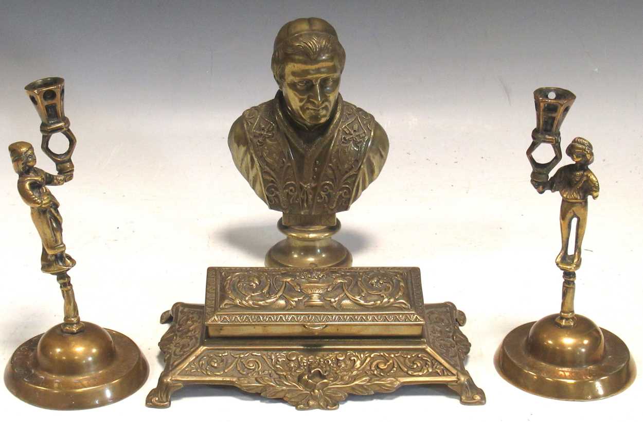 A pair of brass figural candlesticks, a brass bust of Pope Pius IX,20cm high, and a brass inkwell (