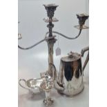 A collection of silverplated items including flatware, 3 light candelabra, coffee pot etc