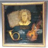 A glazed cased display of musical trophies with moulded bust of Beethoven, 61 x 61 x 17cm