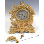 A 19th century ormolu case mantel clock in Rococo style, with silk suspension movement